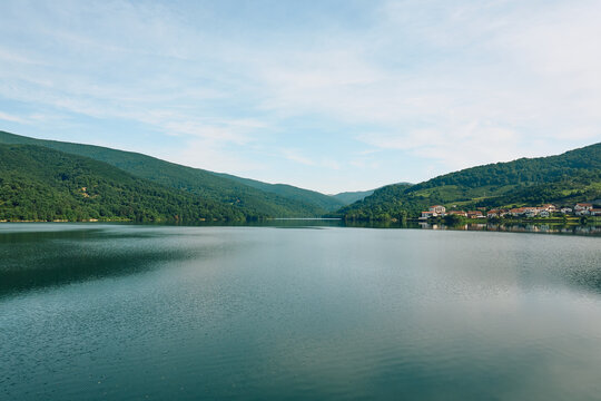 Soft Morning Light Over Lakeside Village And Misty Hills