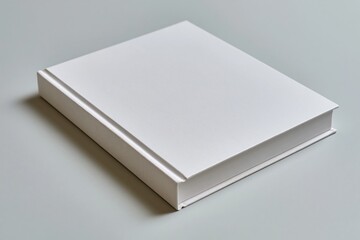 Fototapeta premium The White Blank Book: A Minimal Still Life on a Quiet Desk