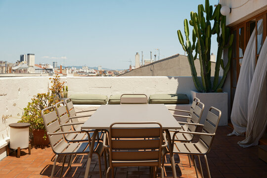 Table and chairs on a sunny terrace