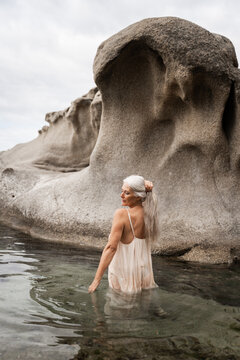 Senior Woman In Natural Rock Pool