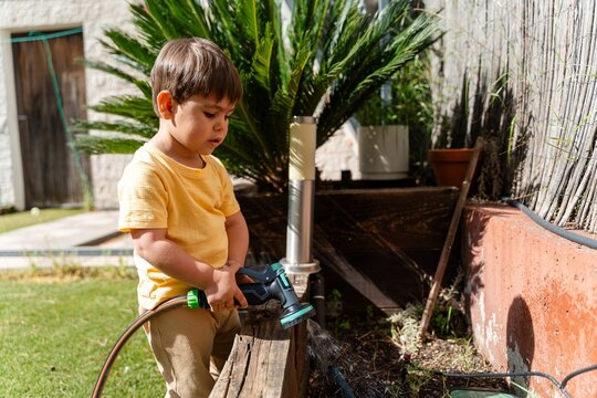 Child Watering Raised Garden Bed
