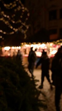 Vertical Blurred View of Christmas Market with People Walking