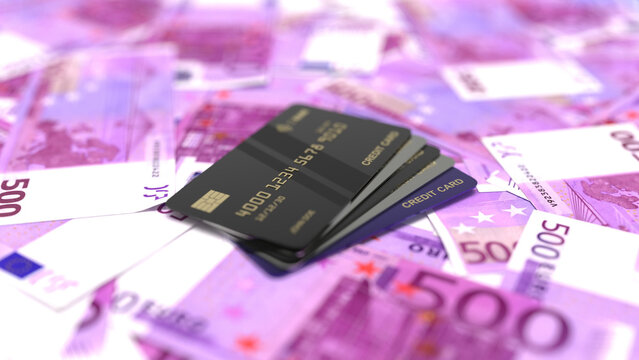 Stack of black credit cards resting on five hundred euro banknotes.