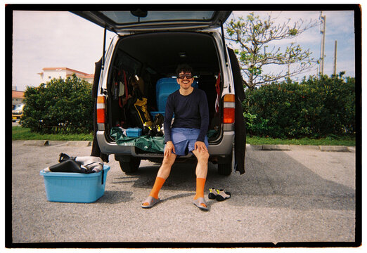 Man Sitting in Van Boot with Dive Gear
