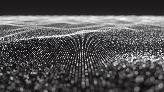 Monochrome abstract background showing wavy patterns of small glowing dots