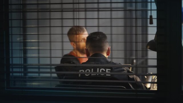 Male suspect giving a statement to a police detective, confession concept