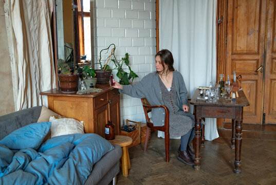 Perfumer crafting a custom fragrance in a studio workspace