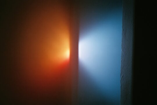 The Light Through a Narrow Doorway Between Warm and Cool Walls