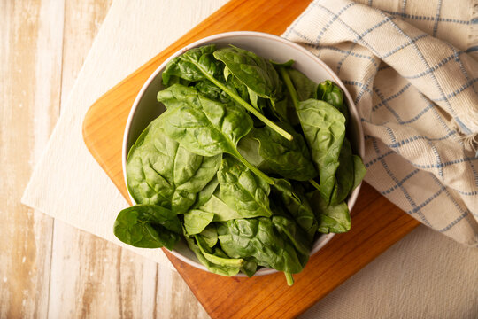 Baby spinach. Fresh and healthy green leaves, ready to eat raw or cooked, are a nutritious ingredient for salads and many vegetarian recipes.