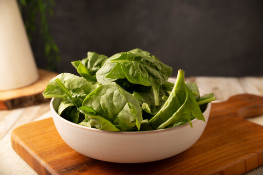Baby spinach. Fresh and healthy green leaves, ready to eat raw or cooked, are a nutritious ingredient for salads and many vegetarian recipes.
