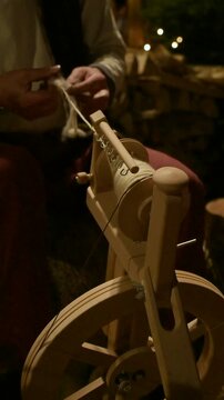 Vertical Video of Traditional Wool Spinning at Christmas Market
