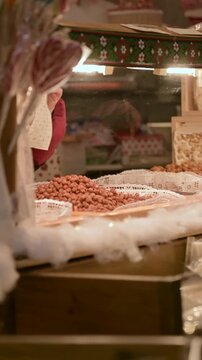 Traditional Caramelized Almonds for Sale at Christmas Market Stall During Winter Holiday Season