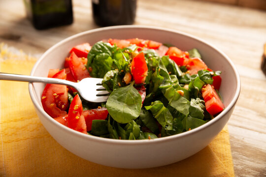 Spinach salad. Fresh and healthy green leaves ready to eat, an easy and nutritious recipe.