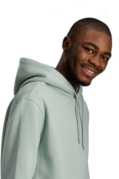 Young cheerful African man smiling warmly in light green hoodie