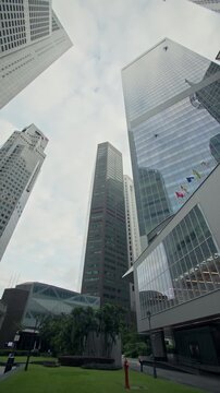 Financial business district in Singapore with elegant glass skyscrapers modern office towers urban skyline and contemporary architecture for travel in Asia