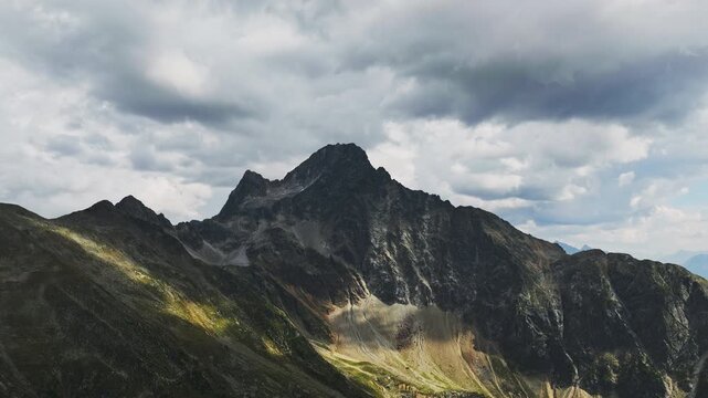 Aerial view of alpine mountains in Tyrol Austria featuring rocky peaks conifer forests and breathtaking natural landscapes for travel in Europe