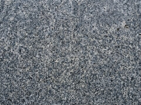 Dark grey granite stone surface texture background with background, material