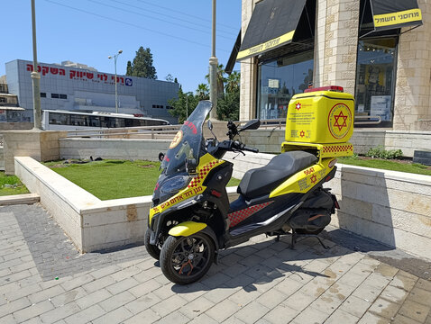 Ramle, Israel &ndash; 14.07.2026. Three-wheeled Magen David Adom paramedic ambulance motorcycle, scooter or moped on the street, Israeli emergency medical response vehicle.