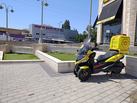 Ramle, Israel &ndash; 14.07.2026. Three-wheeled Magen David Adom paramedic ambulance motorcycle, scooter or moped on the street, Israeli emergency medical response vehicle.