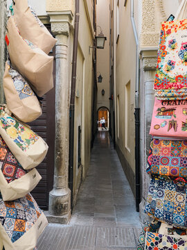 Bags Displayed for Sale in Narrow European Alleyway