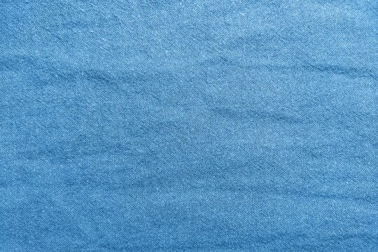 ​Blue wrinkled cotton linen fabric texture background