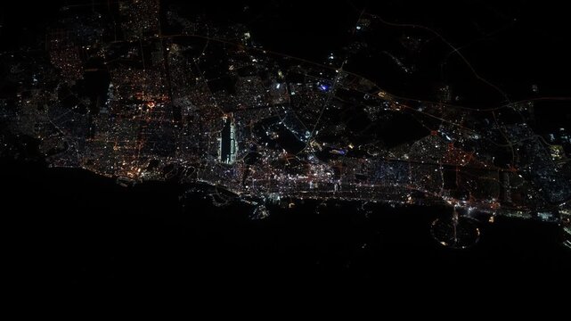 Flying over Dubai at night approaching the illuminated coastline from the Persian Gulf based on Nasa imagery