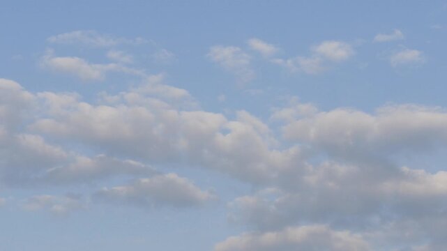 Soft Clouds Floating in a Calm Blue Sky 