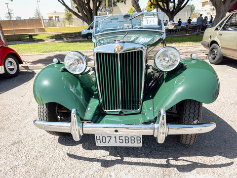 TAVERNES BLANQUES, SPAIN - JUNE 14, 2026.Classic MG TF sports car displayed at vintage auto show in Spain with chrome details and green body
