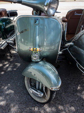 TAVERNES BLANQUES, SPAIN - JUNE 14, 2026.Rare vintage light blue Motovespa Madrid Vespa scooter and sidecar at classic vehicle festival in Spain
