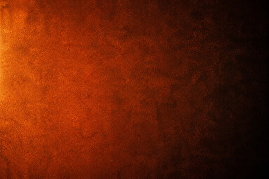 Fiery orange and dark brown textured background with dramatic lighting and warm glow for art.