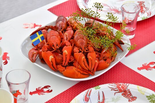 Crayfish parties in Sweden.On the plate are crayfish boiled in beer with dill