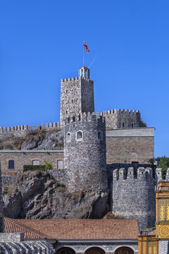 View of the main castle tower with flag in Rabati fortress, Georgia. Historic stone citadel medieval architecture.