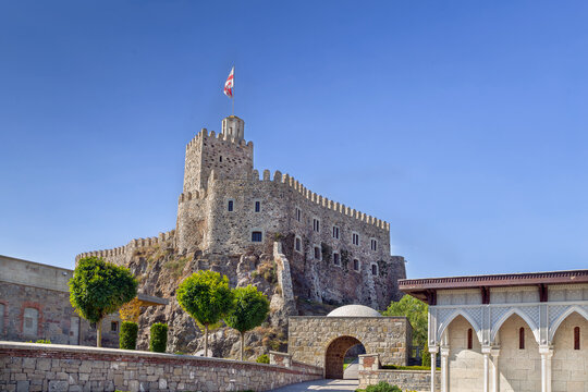 View of the main castle tower with flag in Rabati fortress, Georgia. Historic stone citadel medieval architecture.