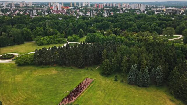  Aerial Drone Landscape Park Forest Residential Buildings Horizon. A high angle drone view capturing the vast greenery of Citadel Park filled with dense trees and open lawns