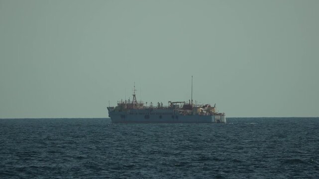 Ship, Ocean, Seascape, large industrial vessel sails on calm sea under hazy sky