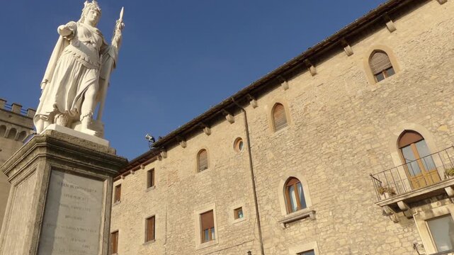 SAN MARINO - NOVEMBER 27 2016: Palazzo Pubblico (Public Palace) is town hall of City of San Marino and Statue of Liberty. Captains Regent, Grand and General Council, Council of XII, Congress of State.