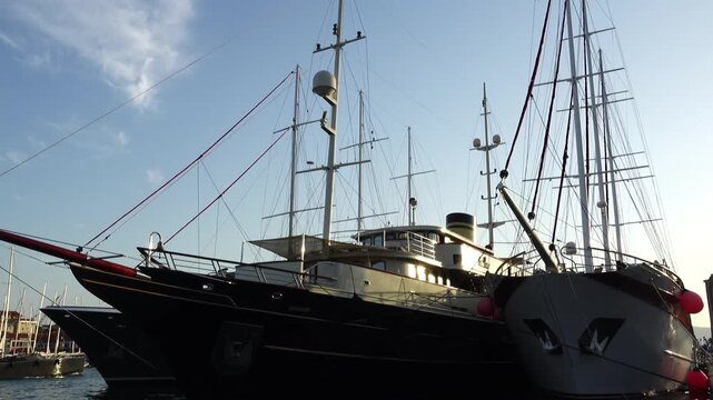 TROGIR, CROATIA - AUGUST 3 2017: Beautiful large yachts and ships on pier about Kastel Kamerlengo.