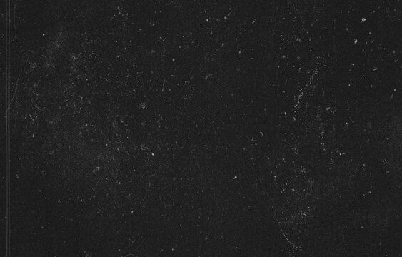 Black grunge texture overlay background with vintage film scratch effects, dust particles, and grain for graphic design.