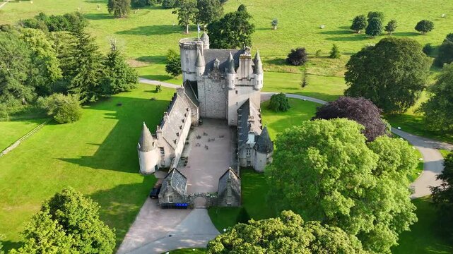 Slow motion drone shot hovering over Castle Fraser historic Scottish castle Aberdeenshire ,  United Kingdom