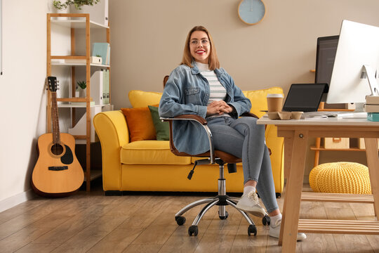 Female programmer working at table in office