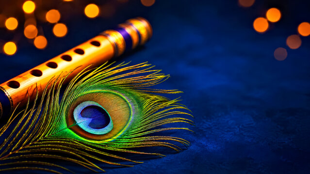 Peacock Feather and Flute on Dark Blue Background with Bokeh Lights