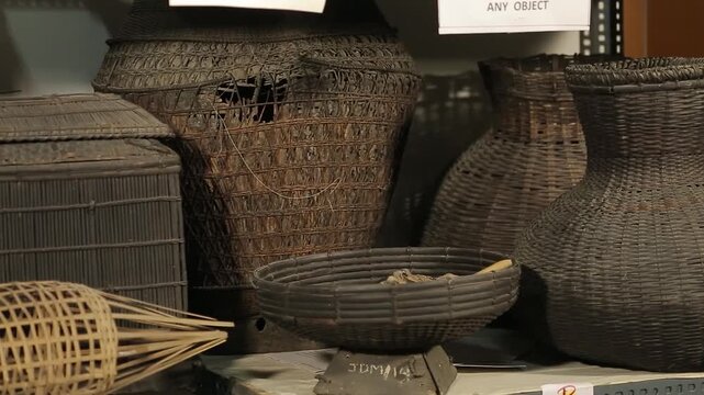 Close up display of traditional ancient bamboo crafts tools and tribal heritage artifacts preserved in Majuli Assam India 4K footag