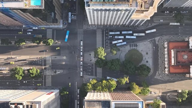 Rio de Janeiro in sunrise, Brazil. City center. Aerial view, establishing shot. Get&uacute;lio Vargas Avenue. Candelaria church
