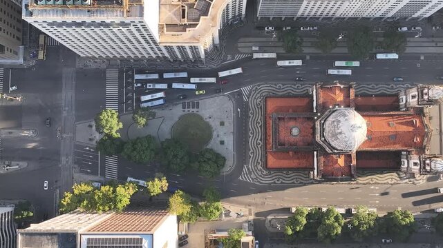 Rio de Janeiro in sunrise, Brazil. City center. Aerial view, establishing shot. Get&uacute;lio Vargas Avenue. Candelaria church