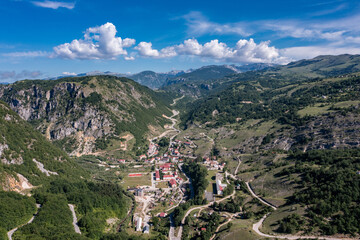 Fototapeta premium Aerial view of Savnik town and surrounding mountain landscape in Montenegro