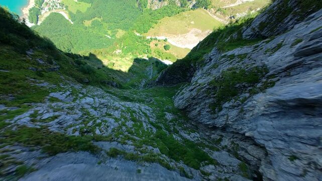 FPV Descent from Green Alpine Mountain to Turquoise Swiss Lake