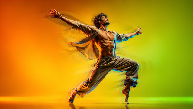 Male dancer performing energetic contemporary dance against colorful gradient background
