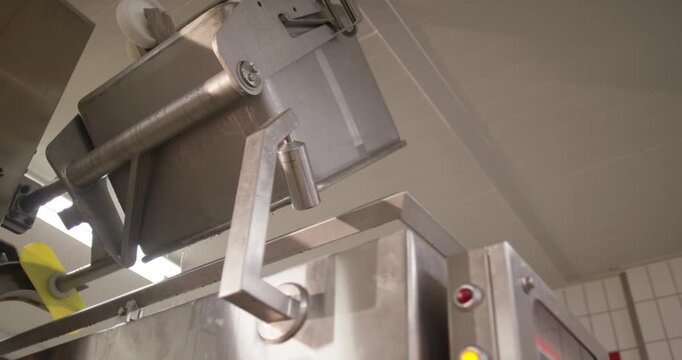 Stainless steel tipping device emptying trolley in meat plant