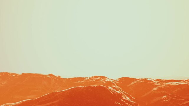 Mountains are visible under a bright sky as the sun sets. The scene shows warm colors of orange and yellow. This moment captures the transition from day to night.