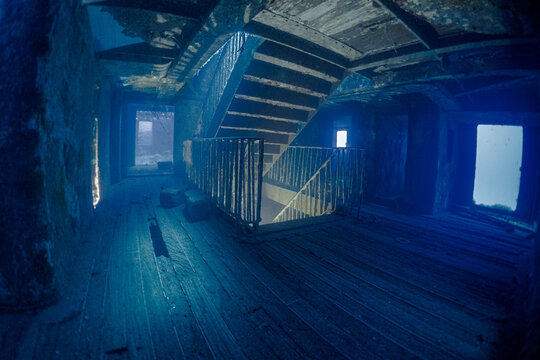 Interior view of the famous staircase inside the MV Karwela shipwreck near Gozo, Malta. The intentionally scuttled wreck is one of the Mediterranean's most iconic scuba diving sites